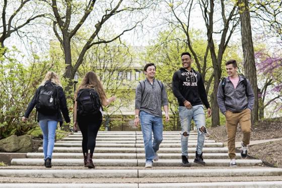 Photo of Chatham University students walking together outside on Shadyside Campus